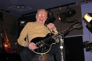 Les Paul with one of his signature guitars outfitted with a Bigsby Vibrato